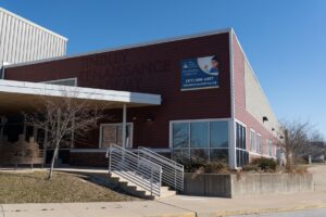 Exterior and front entry of Indy STEAM Academy building framed by blue sky
