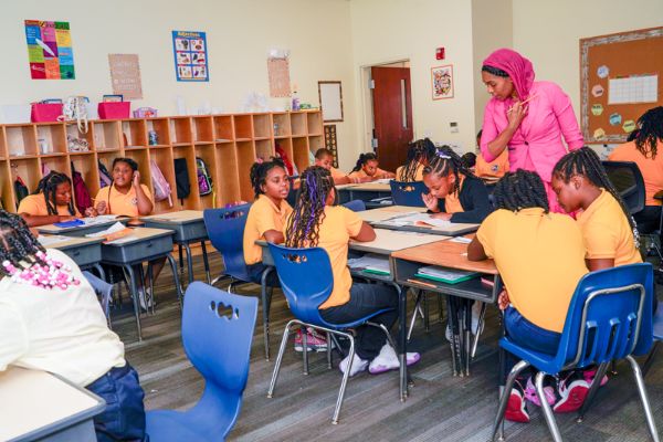 IndySTEAM Academy scholars learn Science, Technology, Engineering, Arts, and Mathematics, while wearing the school uniform of yellow shirts.